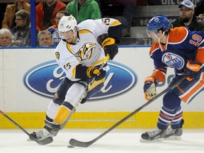 Craig Smith is chased by Oilers defenceman Justin Schultz during the Predators last visit to Edmonton, in January. (USA TODAY)