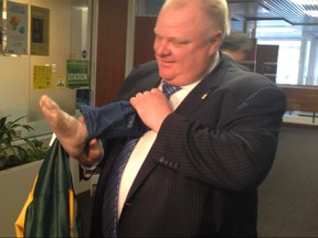 Mayor Rob Ford with a fake foot - an old Halloween decoration - at City Hall on Tuesday, March 18, 2014. (Don Peat/Toronto Sun)