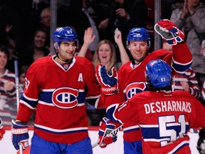 Montreal Canadiens winger Thomas Vanek (centre) celebrates a goal against the Colorado Avalanche with teammates at the Bell Centre in Montreal, March 18, 2014. (RICHARD WOLOWICZ/Getty Images/AFP)