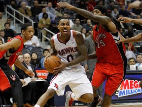 Hawks guard Jeff Teague drives to the basket against the Raptors John Salmons in overtime at Philips Arena. The Hawks defeated the Raptors 118-113. (Brett Davis-USA TODAY Sports)