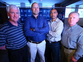 Argonauts head coach Scott Milanovich (second from left) introduced his coaching staff for the 2014 season yesterday, and they are (from left) Jim Daley (special teams), Marcus Brady (offensive co-ordinator) and Tim Burke (defensive co-ordinator). (DAVE ABEL/Toronto Sun)