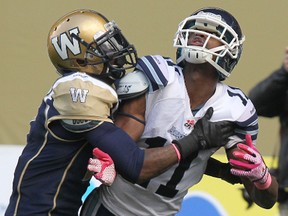 The Canadian Football League is looking to crack down on pass interference, such as the play seen in this photo. (KEVIN KING/QMI Agency)
