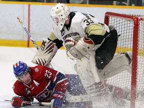 Kingston Voyageurs' Brody Heleno crashes into Trenton Golden Hawks' goalie Denny Dubblestyne during Tuesday's game in Trenton. The teams meet in Game 5 tonight in Kingston at the Invista Centre. 
Tim Meeks/The Trentonian