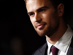Cast member Theo James poses at the premiere of "Divergent" in Los Angeles, California March 18, 2014. REUTERS/Mario Anzuoni