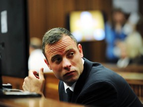 Olympic and Paralympic track star Oscar Pistorius sits in the dock during court proceedings at the North Gauteng High Court in Pretoria March 19, 2014. (REUTERS)