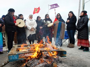 About a dozen people - 50 at some point through the day (above) - set up camp by the tracks on Wyman Road, south of Old Highway 2, near Tyendinaga Mohawk Territory, Ont. early Wednesday morning, March 19, 2014, to bring attention to missing indigenous women and demanding the federal government to open a formal inquiry. - JEROME LESSARD/THE INTELLIGENCER/QMI AGENCY