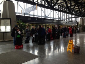 VIA passengers in Ottawa wait for a bus after more than 4,000 travelers were affected by blockades. Sophie ﻿Desrosiers/Ottawa Sun