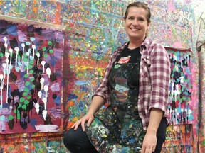 Sarah Ford stands in the splatter room at 4 Cats Art Studio, where aspiring artists spent their March Break brushing up on their skills. The Byron studio offers painting workshops for children and adults. Photo by Brent Boles.