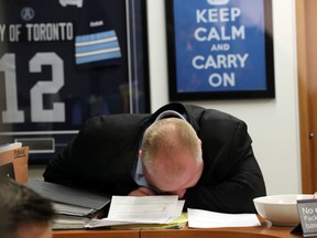 Toronto Mayor Rob Ford talks to his office receptionist on the day more documents were released about his alleged crack use on March 19, 2014.  (Michael Peake/Toronto Sun)