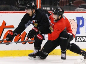 Ottawa Senators' Jared Cowen (left) and Bobby Ryan battle during practice at the Canadian Tire Centre on Wednesday. Errol McGihon/Ottawa Sun