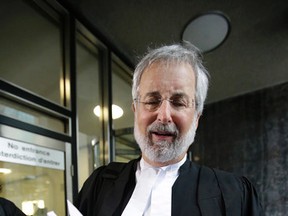 Lawyer Peter Jacobsen, outside the University Ave. courthouse, talks with media members about newly released court documents involving Mayor Rob Ford on March 19, 2014. (Craig Robertson/Toronto Sun)