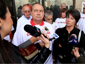 Dylan McGillis's parents Grant McGillis (l) and Marlene Beres speak to the media.  The family of Dylan McGillis left the courthouse after sentence was pass at the downtown courthouse in Edmonton, Alberta on Wednesday, March 19, 2014.  Cleophus Decoine-Zuniga was found guilty of manslaughter seven years after McGillis was fatally stabbed on Whyte Avenue.  Perry Mah/ Edmonton Sun