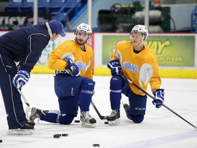Sudbury Wolves associate coach David Matsos, left, speaks with forwards Nathan Pancel, middle, and Dominik Kahun and practice on Wednesday.
Gino Donato/The Sudbury Star