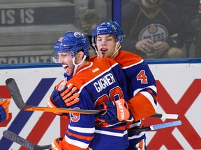 Sam Gagner and Taylor Hall celebrate Gagner's first-period goal Tuesday at Rexall Place. (Ian Kucerak, Edmonton Sun)