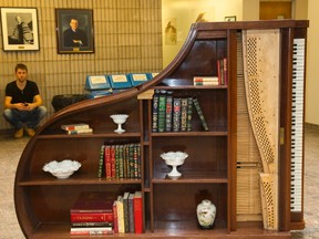 An 1896 grand piano made by Bechstein has been gutted and turned into a bookcase by Western?s piano technology program. (MIKE HENSEN, The London Free Press)