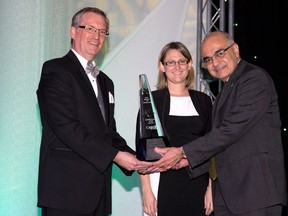 Bharat Masrani, COO and incoming CEO of TD Canada Trust, accepts the Business Icon Award from London Chamber of Commerce president Dave Craven and president elect Andre Feddema during the Business Achievement Awards in London, Ont. on Wednesday March 19, 2014.DEREK RUTTAN/The London Free Press/QMI Agency