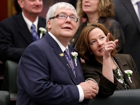 Dave Hancock, now Alberta's premier, and then-premier Alison Redford look up at members of the gallery as they arrive for the Speech from the Throne at the Alberta Legislature, in Edmonton Alta., on Monday March 3, 2014. (David Bloom/Edmonton Sun/QMI Agency)