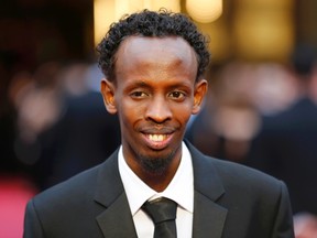 Barkhad Abdi, best supporting actor nominee for his role in "Captain Phillips", arrives at the 86th Academy Awards in Hollywood, California March 2, 2014. (REUTERS/Mike Blake)