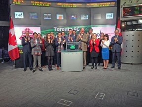 Members of TFC, including captain Steven Caldwell (centre), rang the bell to open the Toronto stock exchange yesterday on Bay Street. (TORONTO FC)