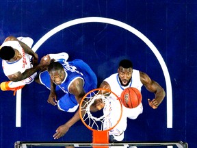 You could say No. 1 seed Florida Gators (in white) have momentum — they’ve won 26 games in a row. (AFP)