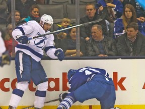 Leafs’ Paul Ranger gets hammered into the end boards by Alex Killorn late in the first period. (JACK BOLAND/Toronto Sun)