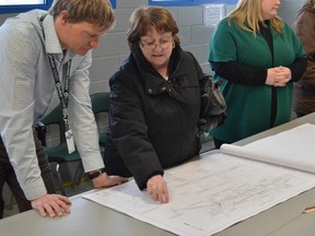 Jim Moodie/The Sudbury Star
In this file photo, David Kalvianen, roads engineer with the City of Greater Sudbury, and Plumtree Crescent resident Ginette Kingsley discuss the drainage work that will be part of a proposed, but delayed, $5 million makeover for Second Avenue in Minnow Lake.