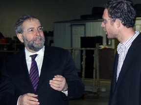 Tom Mulcair, left, makes a point with Erie Structures President Will DenDekker  Wednesday in Tillsonburg. Mulcair stopped in for tour and a discussion that revolved around jobs, sustainability and local food.