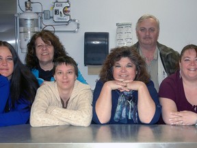 A group of individuals associated with a new active business centre in St. Thomas stand behind the centre's kitchen counter. The centre is run by the Home Based Business Association and aims to help home-based businesses grow by providing low-cost commercial space. From left - facility manager Christina D'Haene, Kim Davis of InsideElgin.com, Elizabeth Windover of Active Abundance, HBBA president Wanda Taylor of Taylor Music Studios, HBBA board member Randy Killey, and Marie Findlay of Ethereal Therapies.