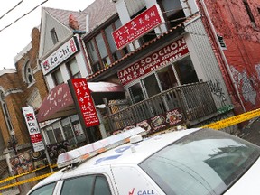 A three-alarm fire broke out in this Kensington Market building just before 2 a.m. Thursday. (DAVE THOMAS/Toronto Sun)