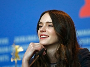 Cast member Stacy Martin smiles during a press conference to promote the movie "Nymphomaniac Volume I" during the 64th Berlinale International Film Festival in Berlin February 9, 2014. REUTERS/Tobias Schwarz