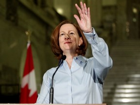 Alberta Premier Alison Redford waves to cheering supporters after announcing her resignation at the Alberta Legislature, in Edmonton Alta., on Wednesday March 19, 2014. David Bloom/Edmonton Sun/QMI Agency