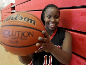 Sisler Spartans guard Kyanna Giles holds a basketball in Winnipeg, Man. Wednesday March 19, 2014. Giles is ranked as the top female high school basketball player in the province. (Brian Donogh/Winnipeg Sun)