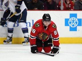 Patrick Kane #88 of the Chicago Blackhawks is slow to get up after suffering an apparent injury in the second period against the St. Louis Blues at the United Center on March 19, 2014 in Chicago, Illinois. (Jonathan Daniel/Getty Images/AFP)