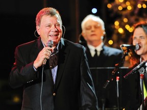 Actor and singer William Shatner (L) performs before the start of the 82nd Annual Hollywood Christmas Parade in Los Angeles, California, December 1, 2013. (REUTERS/Gus Ruelas)