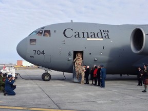The last of Canada's troops to return from Afghanistan are greeted by dignitaries including Gov. Gen. David Johnston and Prime Minister Stephen Harper, as they arrive on March 18 at the Ottawa International Airport, marking the end of Canada's  participation in the Afghanistan war, a mission that spanned 12 years. 
 MICHEL COMTE/AFP