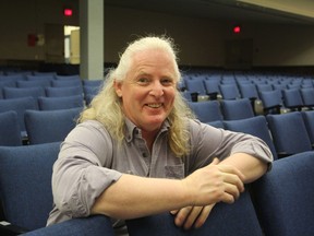 Kingston Collegiate drama teacher Kevin Fraser sits in the school auditorium, where the Sears Ontario Drama Festival will be held March 25 to 29. (Michael Lea/The Whig-Standard)