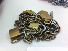 The chains and padlocks used to hold a 16-year-old boy captive on display on evidence table in Bridgewater courtroom. (Kris Sims/QMI Agency)