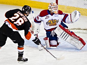 Edmonton’s Tristan Jarry makes a glove save against Medicine Hat’s Cole Sanford earlier this season. At the age of 18, the Oil Kings’ netminder has seen a lot of success this seasonm including the modern-day franchise record with 44 wins and eight shutouts. Game 1 goes Saturday at Rexall Place. (Codie McLachlan, Edmonton Sun)