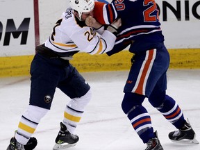 Oilers forward Luke Gazdic trades blows with Sabres’ Zenon Konopka during the first period of Thursday's game at Rexall Place. (David Bloom, Edmonton Sun)