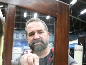 Gino Donato/The Sudbury Star
Paul Bertrand of Trand Kitchens screws a handle on a kitchen cabinet door at the Sudbury Community Arena on Thursday afternoon, in preparation for this weekend's Sudbury & District Homebuilders Association Sudbury Home Show. The show gets underway today at 5 to 9 p.m., then Saturday 10 a.m. to 5 p.m. and Sunday 10 a.m. to 4 p.m., admission is $7 for the weekend kids are free, seniors $5.