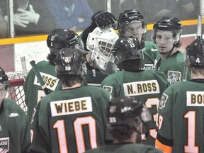 The Terriers console goaltender Talor Joseph after Game 7 of the Addison Division semifinal series, won by Steinbach 4-0 on Mar. 20. (KEVIN HIRSCHFIELD/THE GRAPHIC)