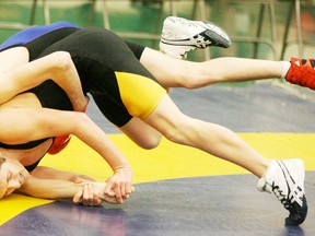 Wrestlers grapple during Edmonton zone championships at MCHS. - Gord Montgomery, File Photo