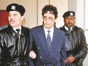Abdelbaset Ali Mohmet al-Megrahi, the only person convicted in the 1988 Lockerbie bombing, is seen being escorted by a Libyan security officer in February 1992, above, and at home in Tripoli, right, seven months before his death in 2012.  REUTERS FILE
