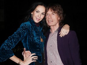Musician Mick Jagger and designer L'Wren Scott pose following her Fall/Winter 2012 collection during New York Fashion Week in this February 16, 2012 file photo. (REUTERS/Carlo Allegri/Files)