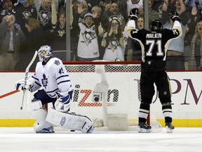 Pittsburgh Penguins centre Evgeni Malkin celebrates his game-winning goal in the shootout as Toronto Maple Leafs goalie Jonathan Bernier reacts on Nov. 27, 2013. (Charles LeClaire/USA TODAY Sports)