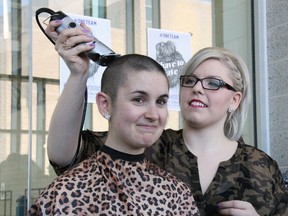 Western Mustangs rower Natasha Caminsky reacts to having her head shaved by Tammy McCutcheon of the university's Spirit Hair Studio during the “Shave to Save” event at the Western University Student Rec Centre March 21. Caminsky and fellow Mustang rowers Genevieve Favreau, Jessie Loutit and Kalle Maclennan all took part, so too did tennis player Katie Vincent, raising over $5,500 for the Canadian Cancer Society. The event was scheduled  in support of Mustang rower Natalie Connell, who was diagnosed with non-Hodgkin lymphoma in December.
JACOB ROBINSON/LONDONER/QMI AGENCY