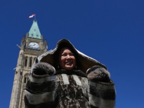 Christine Tootoo of Rankin Inlet, Nunavut wears a sealskin jacket during a demonstration in support of Inuit use and trade of seal products, on Parliament Hill in Ottawa March 18, 2014. REUTERS/Chris Wattie
