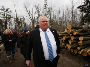 Mayor Rob Ford gets a tour of the tree cutting in Guild Park Thursday March 20, 2014. (Stan Behal/Toronto Sun)