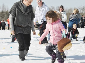 Lexi Chisaakay collects Easter eggs during last year’s  Boys and Girls Club Easter Egg hunt at Rotary Park.
File photo | Whitecourt Star