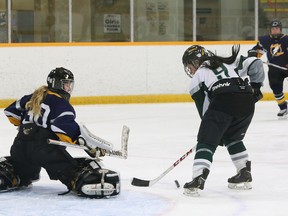 Kailey Peirson of Holy Cross is  denied by Saltfleet goalie Mackenzie McCullough during the OFSAA girls AAA/AAAA hockey gold-medal game at the Gerry McCrory Countryside Sports Complex in Sudbury on Friday. Saltfleet won 1-0. (John Lappa\QMI Agency)